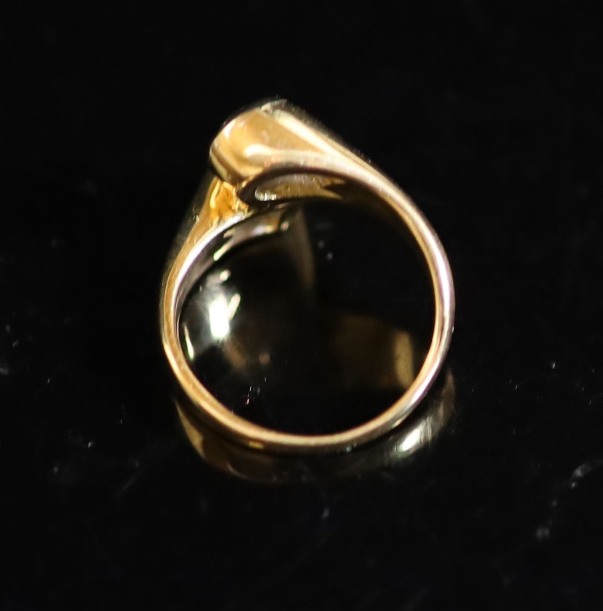 A Continental gold and collet set two stone diamond crossover ring